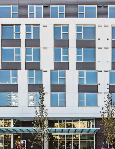 A large apartment building with many windows and balconies.
