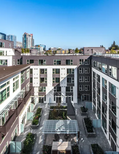 An aerial view of an apartment building with a courtyard.